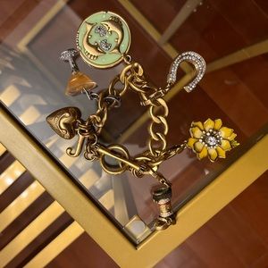 Juicy couture bracelet with 5 charms included.